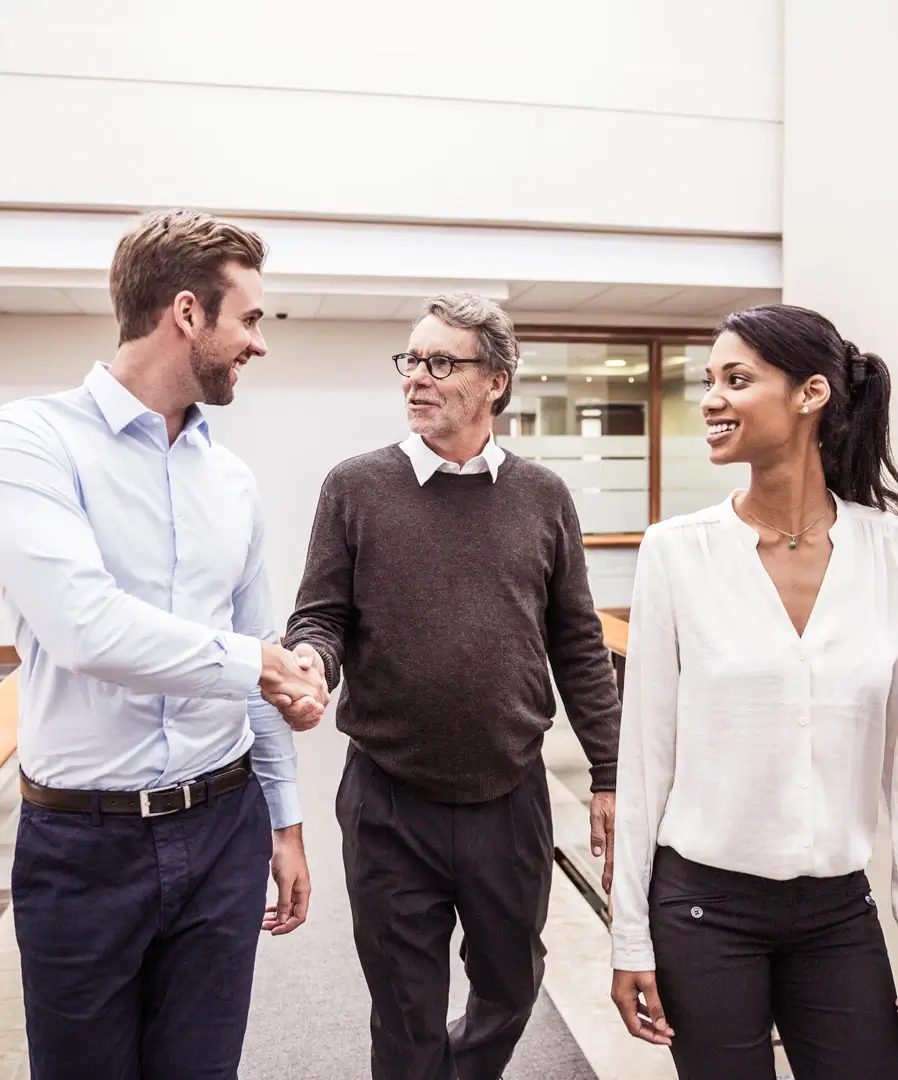 Business people shaking hands after a sucessfull deal