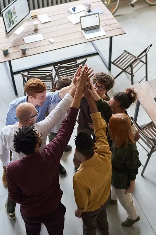 Business people giving high five